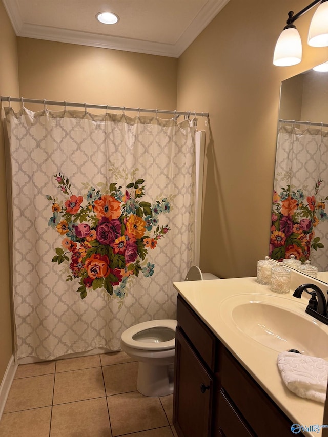 bathroom featuring ornamental molding, toilet, tile patterned floors, and vanity