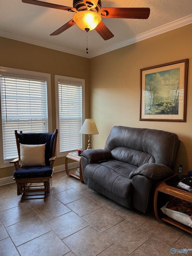 living room with ornamental molding and ceiling fan