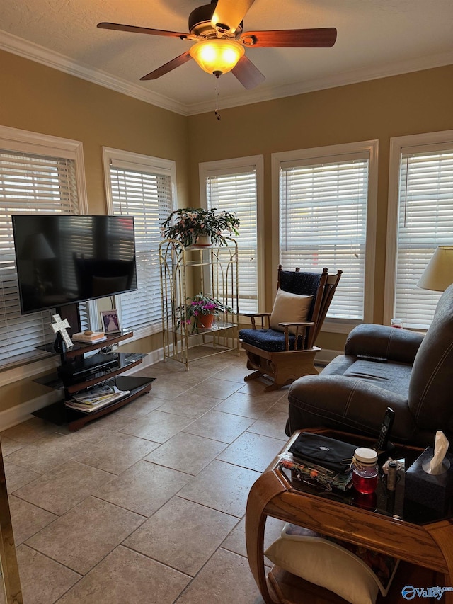 tiled living room with crown molding, plenty of natural light, a textured ceiling, and ceiling fan