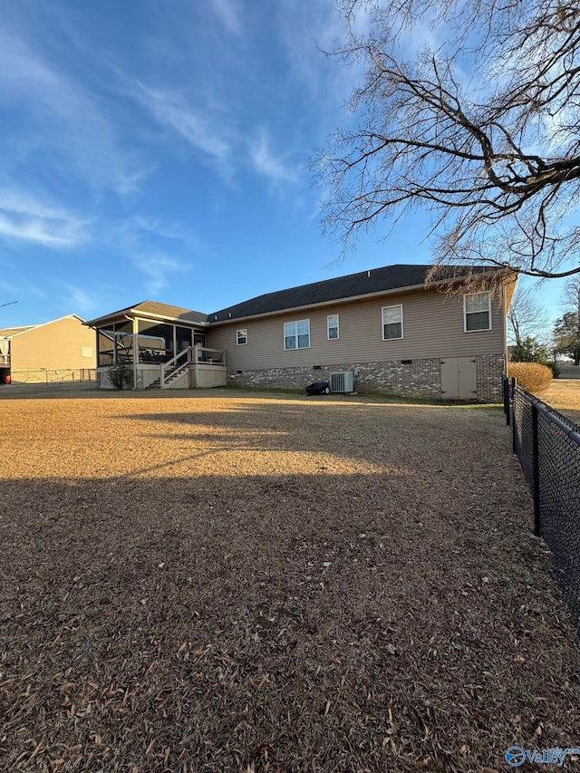 back of house featuring central AC