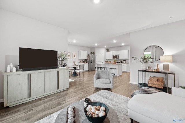 25066 Delilah Cir, Athens, AL 35613 - living area featuring light wood-type flooring, baseboards, and recessed lighting