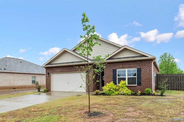 25066 Delilah Cir, Athens, AL 35613 - view of front facade featuring concrete driveway, an attached garage, fence, and brick siding