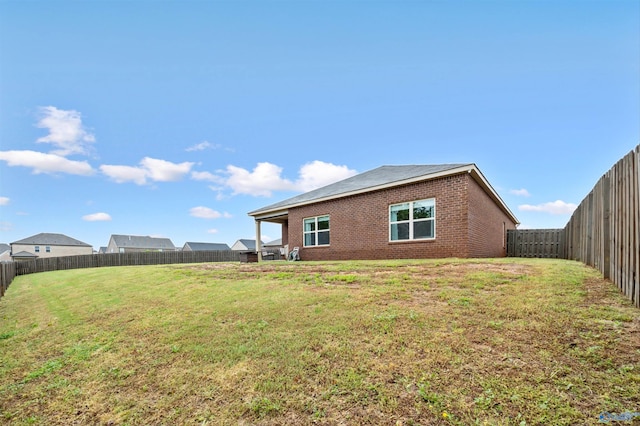 25066 Delilah Cir, Athens, AL 35613 - exterior space featuring a fenced backyard, brick siding, and a yard