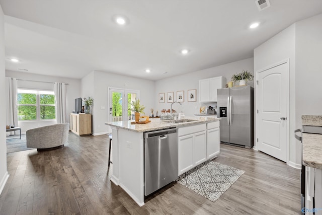 25066 Delilah Cir, Athens, AL 35613 - kitchen with plenty of natural light, a kitchen island with sink, appliances with stainless steel finishes, and a sink