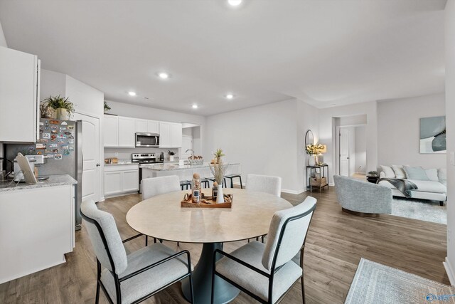 25066 Delilah Cir, Athens, AL 35613 - dining space featuring recessed lighting, wood finished floors, and baseboards