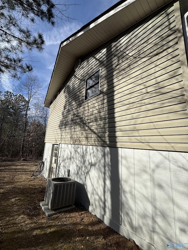 view of home's exterior with central AC unit