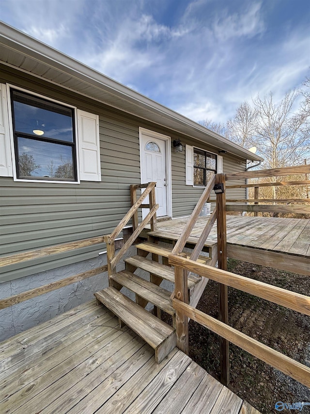 doorway to property featuring a wooden deck