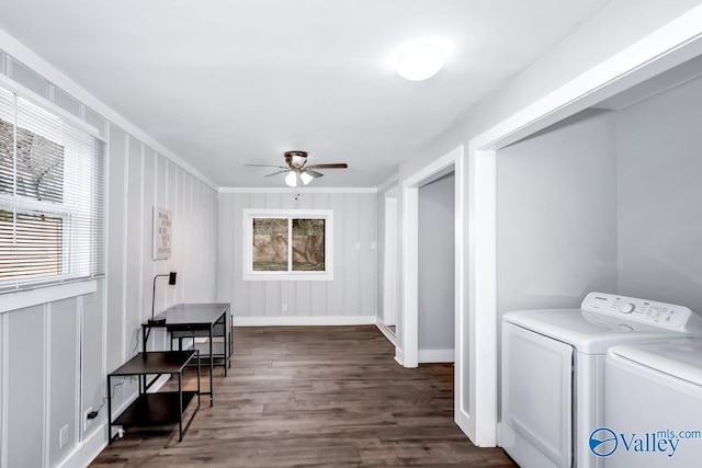 clothes washing area with washing machine and clothes dryer, dark wood-style floors, a ceiling fan, laundry area, and ornamental molding