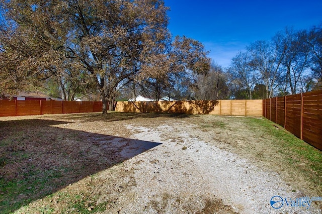 view of yard with a fenced backyard