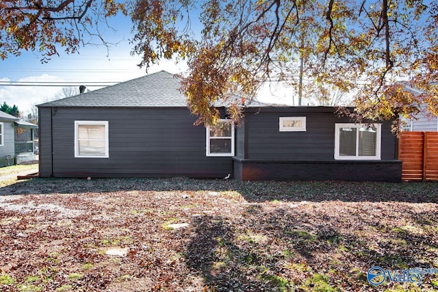 view of home's exterior featuring fence