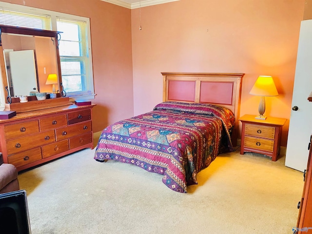 carpeted bedroom with ornamental molding