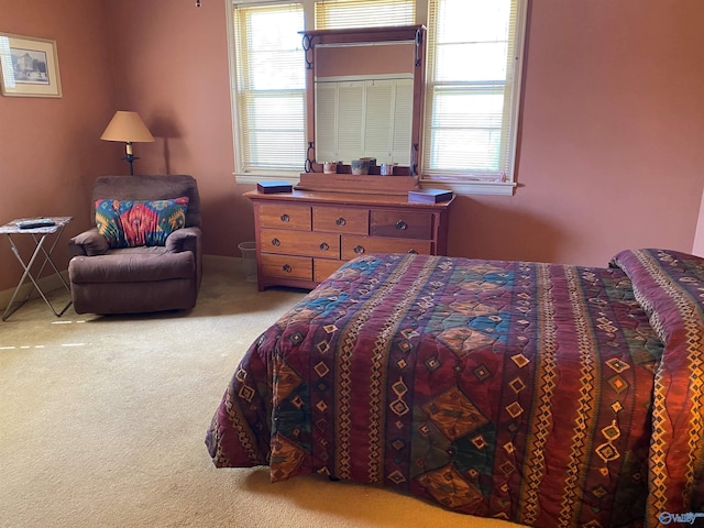 carpeted bedroom with baseboards