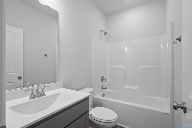 full bathroom with vanity,  shower combination, and toilet