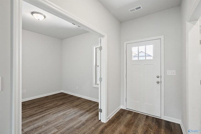 entrance foyer featuring dark hardwood / wood-style floors