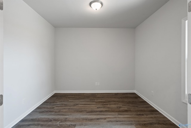 empty room featuring dark hardwood / wood-style flooring