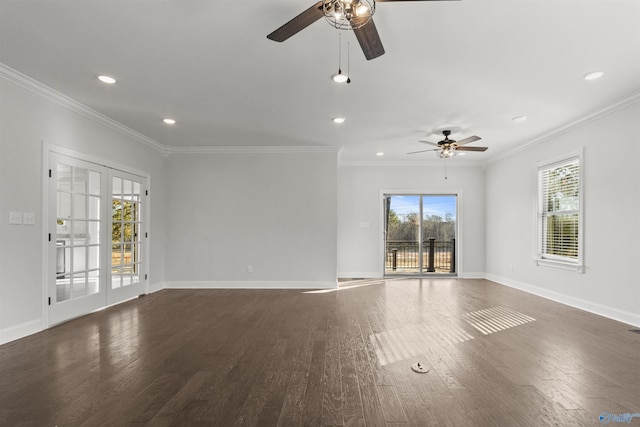 spare room featuring ceiling fan, ornamental molding, and dark wood-type flooring