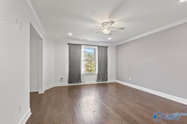 spare room with ceiling fan, dark hardwood / wood-style flooring, and crown molding