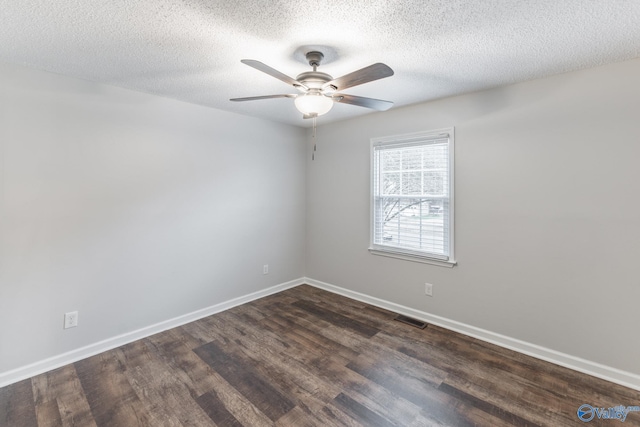 unfurnished room featuring dark hardwood / wood-style flooring, a textured ceiling, and ceiling fan