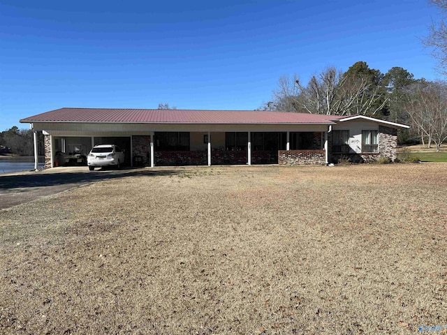 single story home featuring a carport