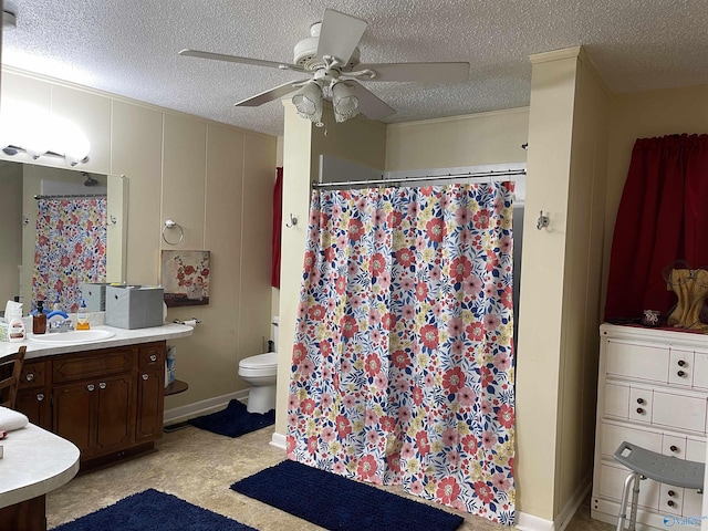 bathroom featuring vanity, a textured ceiling, ceiling fan, and toilet