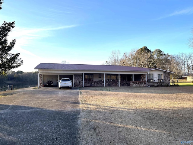 ranch-style house with a carport