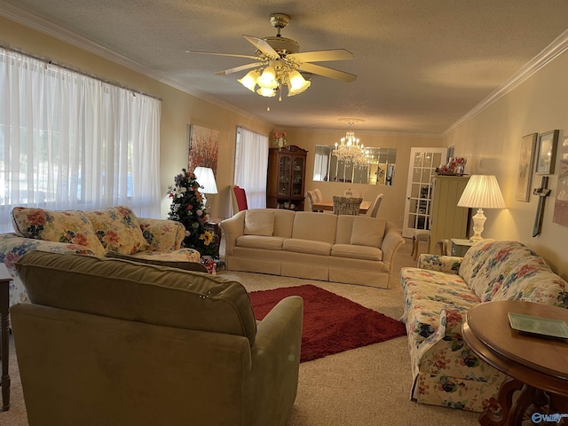 living room featuring ornamental molding, ceiling fan with notable chandelier, light carpet, and a textured ceiling