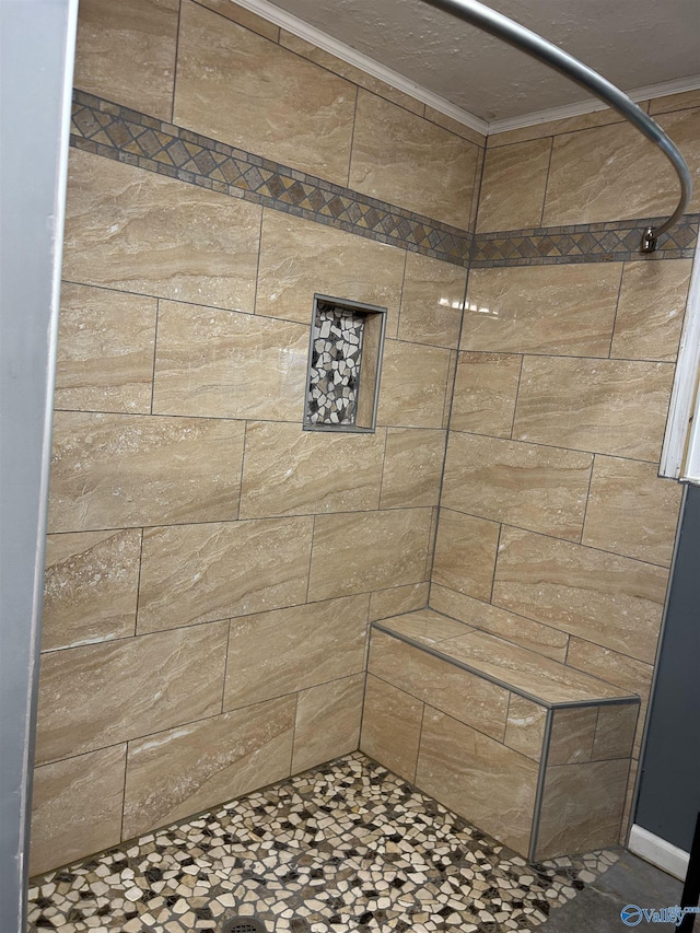 bathroom with a tile shower