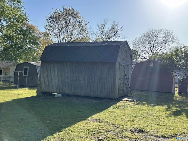 view of shed featuring fence