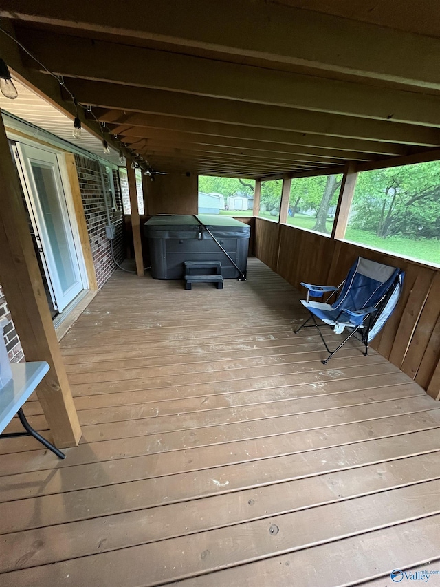 deck featuring a hot tub