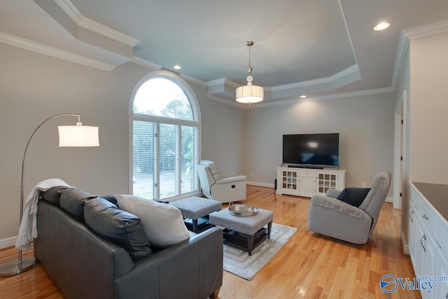 living area with light wood finished floors, baseboards, crown molding, and recessed lighting