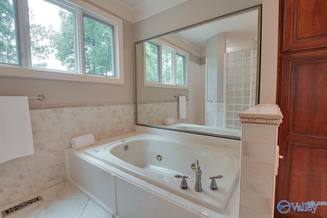 full bathroom with visible vents, a wainscoted wall, a tub with jets, tile patterned flooring, and crown molding