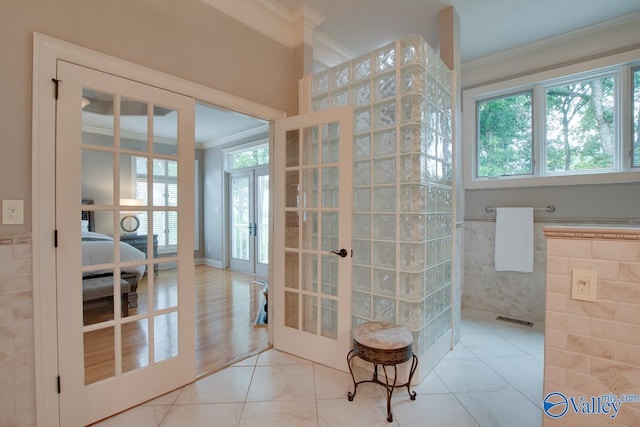 bathroom featuring visible vents, tile patterned floors, walk in shower, crown molding, and french doors