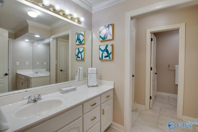 bathroom with ornamental molding, visible vents, vanity, and baseboards