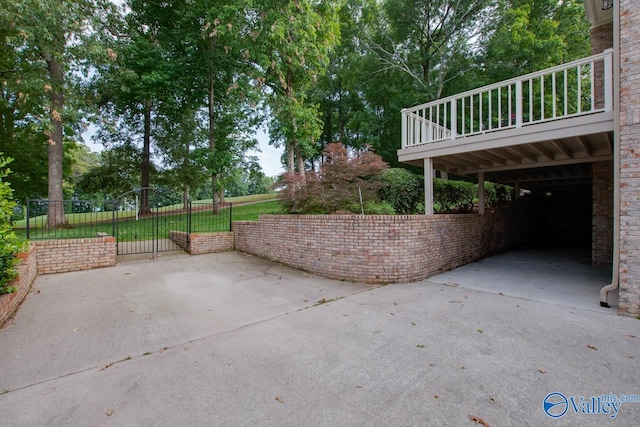 view of patio featuring fence