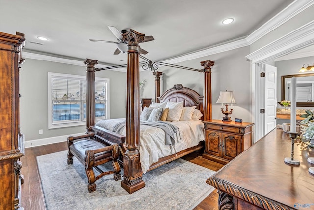 bedroom featuring dark wood-style floors, baseboards, crown molding, and recessed lighting