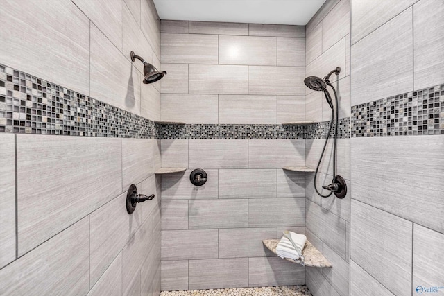 full bathroom featuring tiled shower