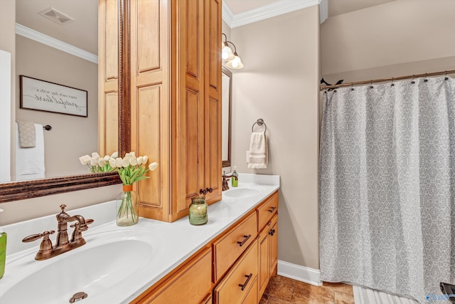 bathroom with double vanity, ornamental molding, a sink, and visible vents