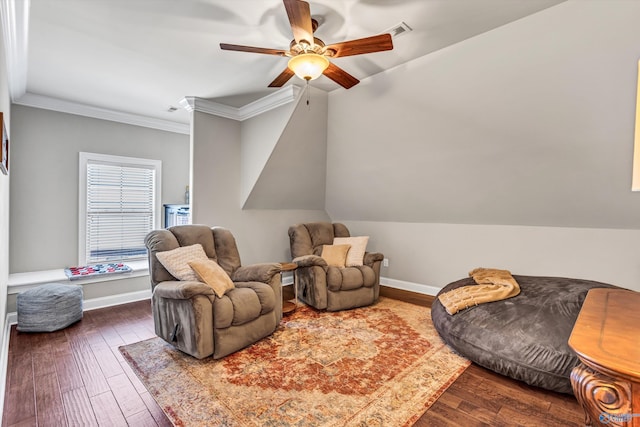 living area featuring ornamental molding, dark wood finished floors, and baseboards