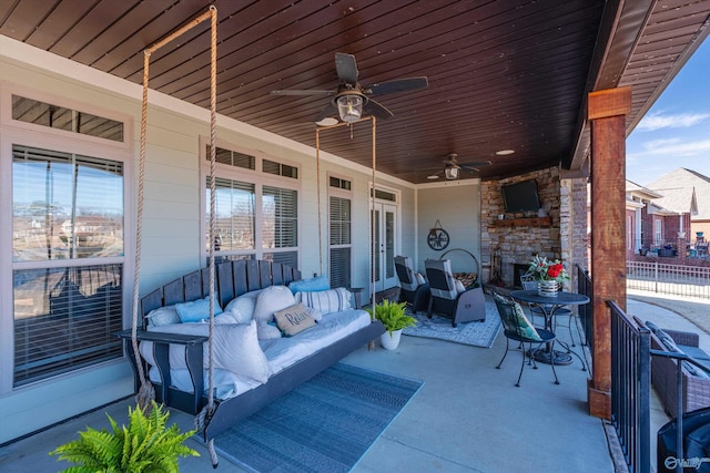 view of patio / terrace with an outdoor hangout area, french doors, and a ceiling fan