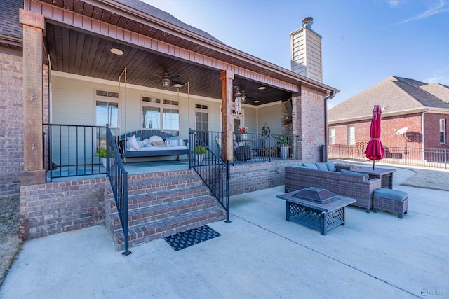 view of patio / terrace with an outdoor hangout area, a porch, and a ceiling fan