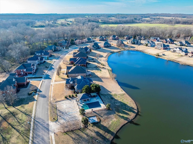 birds eye view of property with a water view and a residential view