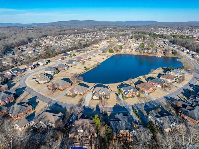 bird's eye view with a water and mountain view and a residential view