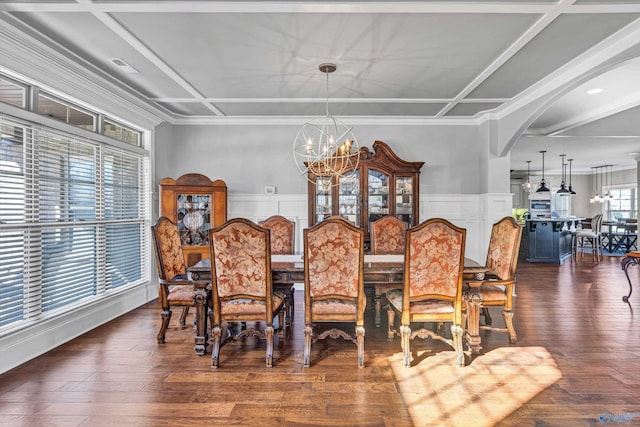 dining area featuring dark wood finished floors, arched walkways, coffered ceiling, and a notable chandelier