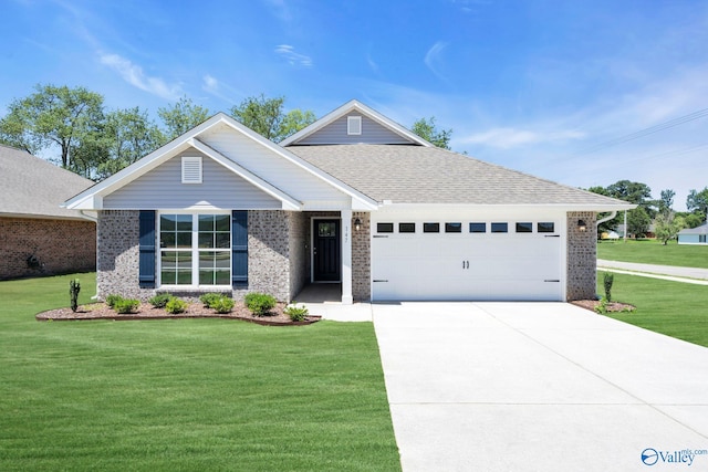 view of front of property featuring a garage, concrete driveway, a front lawn, and brick siding