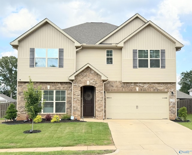 123 River Pointe Dr, New Market, AL 35761 - craftsman-style home with brick siding, driveway, a garage, and board and batten siding