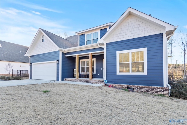 view of front of home featuring covered porch, a garage, driveway, roof with shingles, and crawl space