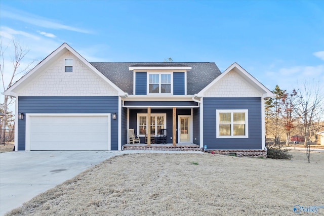 view of front of property featuring a shingled roof, covered porch, concrete driveway, a front yard, and a garage