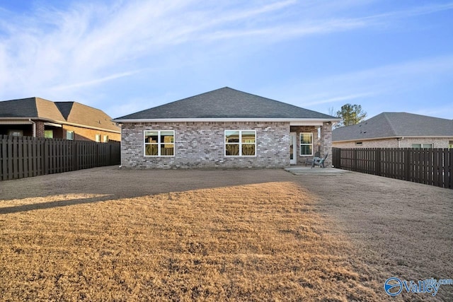 rear view of house featuring a patio