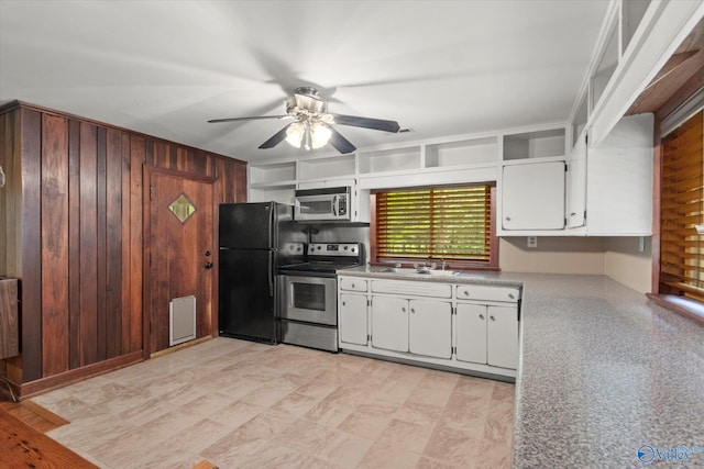 kitchen featuring light tile patterned flooring, ceiling fan, stainless steel appliances, white cabinets, and sink