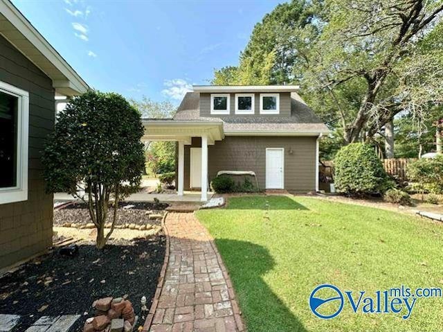 exterior space with a front yard